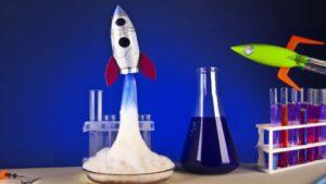 Chemistry experiment rocket candy with rocket in the background - CARE4Space